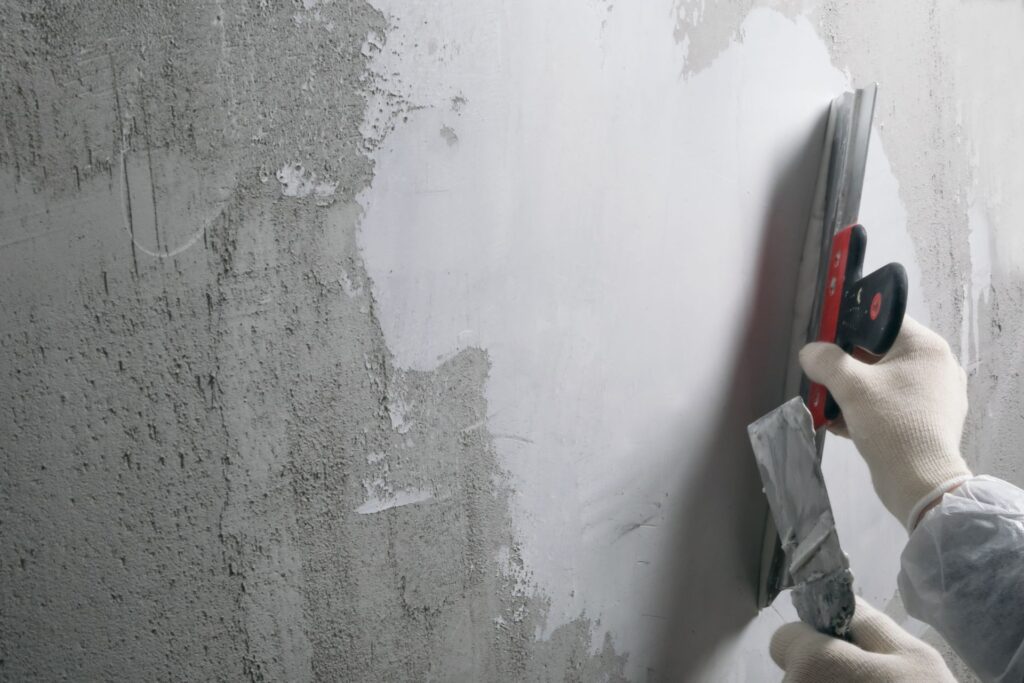 image of stucco contractor performing a stucco repair