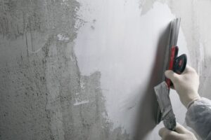 image of stucco contractor performing a stucco repair